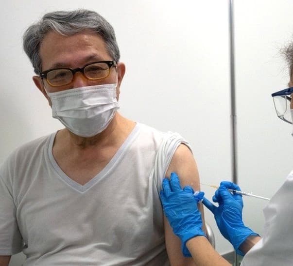 Japan ramps up mass vaccinations in Tokyo and Osaka amid Covid surge