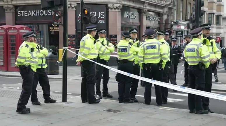 Two police officers stabbed in London – BBC