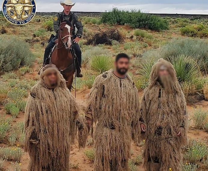 Three wearing ghillie suits to blend in with New Mexico terrain caught