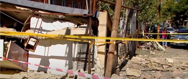 Police and emergency services remain at the scene, while investigators continue to examine the circumstances of the incident