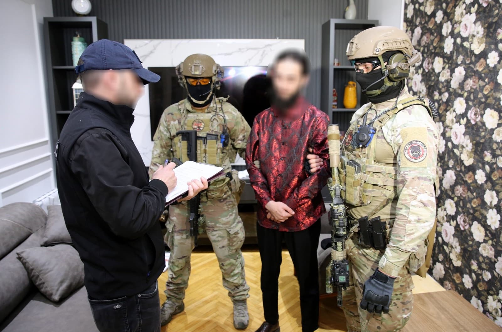 <p><span style="color: rgb(0, 0, 0)">The Counterterrorism Center of the State Security Service (SSS) of Georgia has detained three Georgian citizens in connection with their involvement in a foreign terrorist organization and providing support for terrorist activities, the SSS Deputy Chief Lasha Magradze announced at a briefing on Monday.</span></p><p><span style="color: rgb(0, 0, 0)">Magradze said the investigation revealed that members of the so-called “Takbirist Jamaat”, an extremist group shaped by radical terrorist ideology, had connections with influential foreign leaders of the Islamic State. Acting on judicial orders, the Counterterrorism Center conducted special operations at five separate locations in the Adjara region, resulting in the arrests.</span></p><p><span style="color: rgb(0, 0, 0)">“Based on evidence obtained during operational and investigative activities, certain terrorist activities were identified. Members of the Takbirist Jamaat, under the guidance of influential foreign Islamic State figures, formed a radical-extremist group characterized by extreme aggression toward followers of other religions,” Magradze said.</span></p><p><span style="color: rgb(0, 0, 0)">Authorities reported that the group planned to smuggle foreign Islamic State members into Georgia, establish a base, provide illegal housing and logistical support for affiliates, and use Georgian territory as a transit point for terrorist activities.</span></p><p><span style="color: rgb(0, 0, 0)">During early-morning investigative actions, officers seized items displaying terrorist symbols, explosives, large quantities of ammunition, firearms, military equipment, mobile phones, electronic storage devices, significant sums of various currencies, and other evidence relevant to the investigation.</span></p><p><span style="color: rgb(0, 0, 0)">The probe is being conducted under Articles 236 and 328 of the Georgian Criminal Code, covering the illegal acquisition and storage of firearms, ammunition, explosives, membership in a foreign terrorist organization, and assistance in terrorist activities. Convictions under these articles carry a maximum sentence of 17 years imprisonment.</span></p><p><br></p>