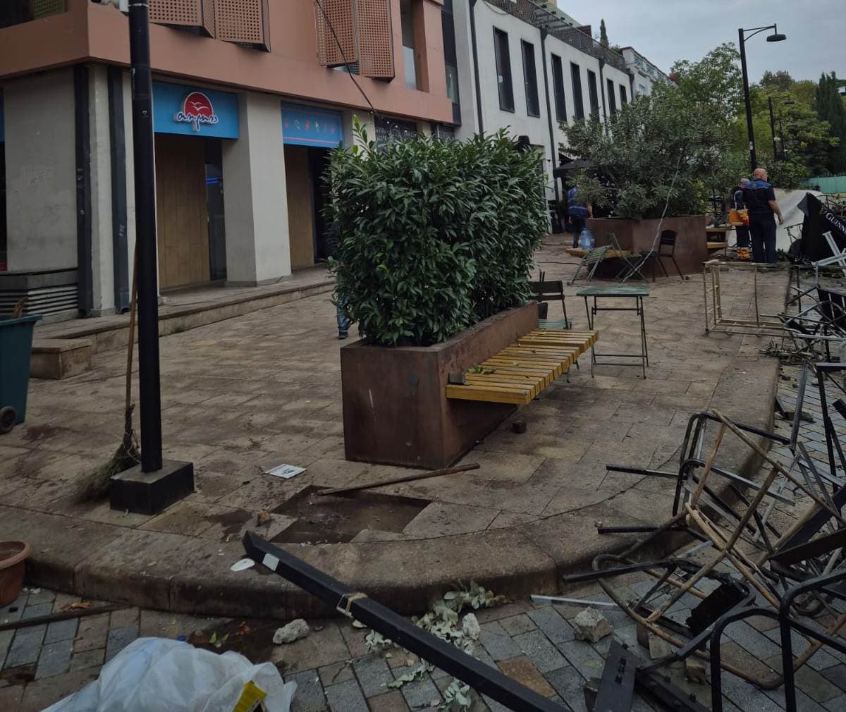 <p style="text-align: justify">The Tbilisi City Hall on Sunday released a statement and photo-video materials detailing damage caused to municipal infrastructure and public property during last night’s protests in the capital.</p><p style="text-align: justify">According to the statement, the protests resulted in harm to several cultural heritage sites and city infrastructure, including facades, decorative lighting, and public amenities in central areas.</p><p style="text-align: justify">“Unfortunately, the protests have caused damage to cultural heritage facades, shutters, and parts of artistic decorative lighting installations. On Orbeliani and Tabukashvili Streets and Rustaveli Avenue, pedestrian pavements, cobblestones, streetlight fixtures, and cables were damaged. Decorative lights on Orbeliani Street were torn down and broken, while waste containers on Tabukashvili Street were burned,” the statement said.</p><p style="text-align: justify">City Hall added that street furniture owned by private companies and café operators was also destroyed. The fence surrounding the Presidential Administration’s courtyard was broken, and nearby bollards separating pedestrian and vehicle zones were bent or damaged.</p><p style="text-align: justify">Various other public elements - including swings, plants, flowerpots, and decorative landscaping - were also heavily damaged, with some completely destroyed. Road signs, a barrier gate near the underground parking area, display boards, and a decorative stage above the parking site were reported broken.</p><p style="text-align: justify">Tbilservice Group, the city’s waste and maintenance service, began clean-up work after gaining access to the area. Burnt and broken materials were removed, and the affected locations were cleaned and organised.</p><p style="text-align: justify">“At this stage, municipal departments are working on-site to restore the damaged infrastructure and return the area to its original condition,” the statement concluded.</p>