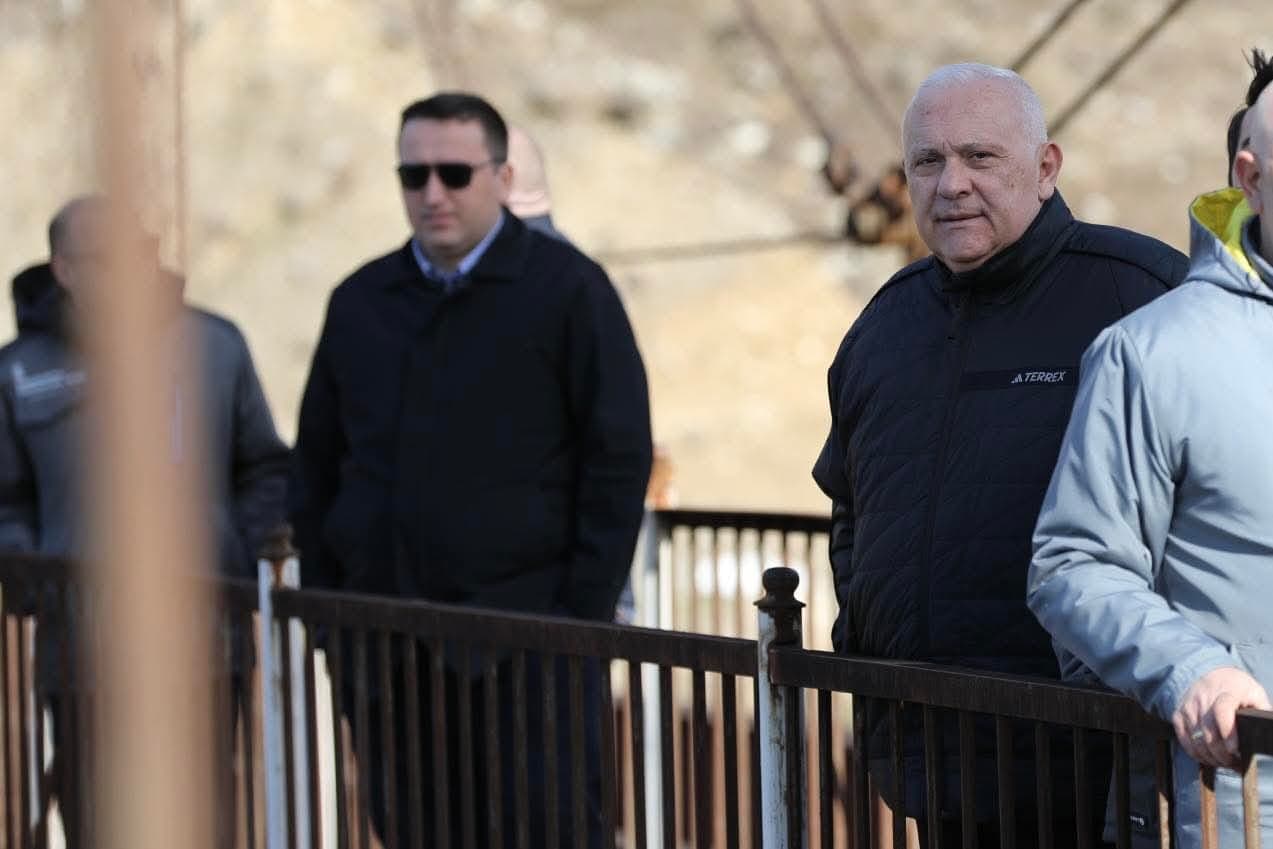 <p style="text-align: justify">Work has begun on a project to rehabilitate the historic suspension bridge over the Magana River in the town of Jvari, in Georgia’s northwestern Tsalenjikha Municipality, and develop it into a tourist attraction.</p><p style="text-align: justify">The initiative is being led by the Ministry of Infrastructure of Georgia, which plans to restore the structure and integrate it into the region’s tourism offering.</p><p style="text-align: justify">The 80-metre pedestrian bridge, built in 1931–1932, is currently damaged. It has been granted the status of a cultural heritage monument.</p><p style="text-align: justify">Infrastructure Minister Revaz Sokhadze inspected the site together with Municipal Development Fund Executive Director Beka Urushadze, Roads Department Chair Levan Darakhvelidze, Member of Parliament Ilia Injia, representatives of the local government, and Enguri Attraction Director Nikoloz Antidze.</p><p style="text-align: justify">Officials reviewed the current condition of the bridge and discussed plans for its rehabilitation and future tourism use.</p>