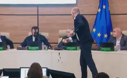CEC Chairman Giorgi Kalandarishvili doused with black liquid during session