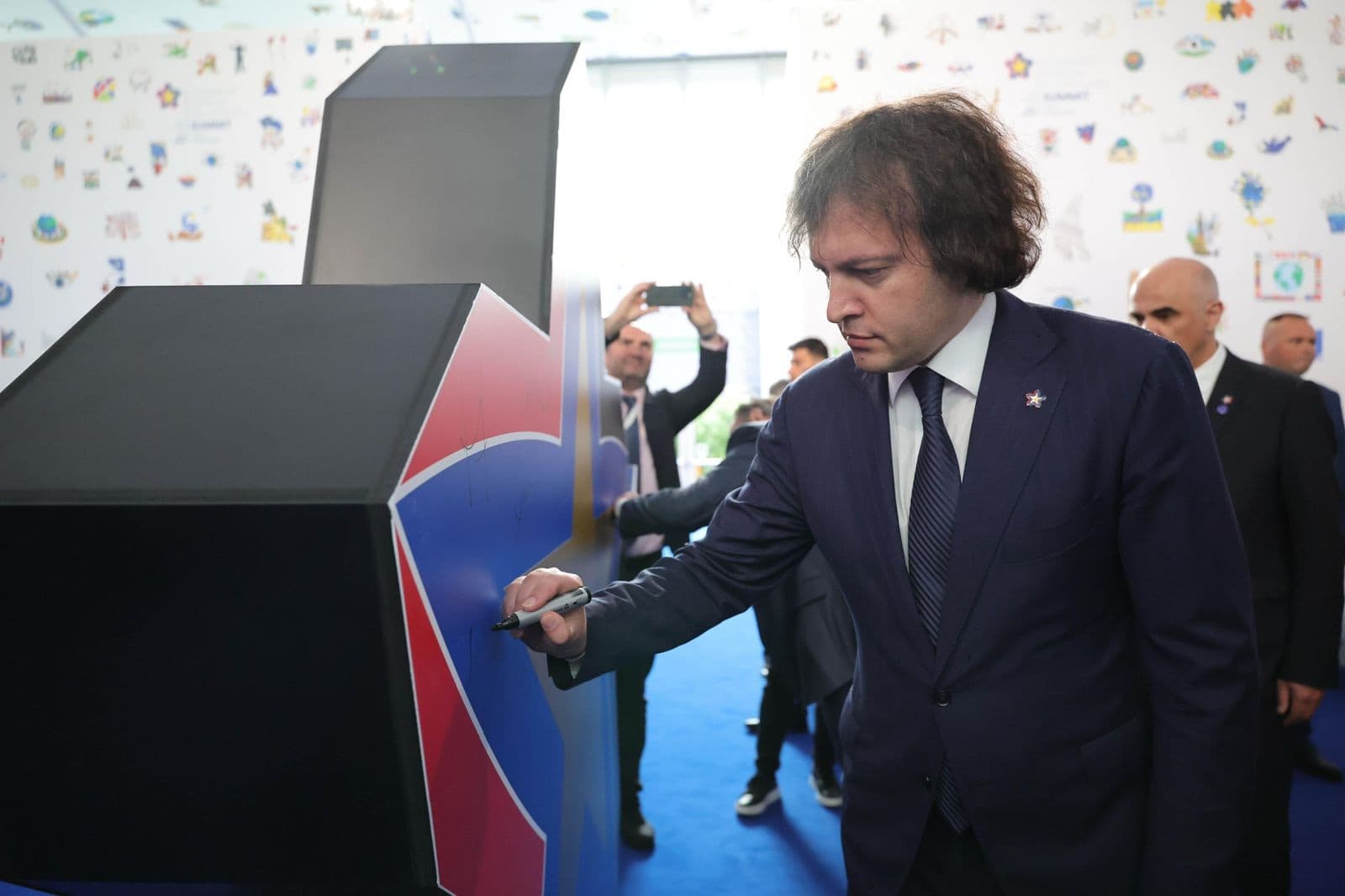 <p><span style="color: rgb(0, 0, 0)">Georgian Prime Minister Irakli Kobakhidze is attending the 6th European Political Union (EPC) Summit in Tirana, Albania, on the invitation of Antonio Costa, President of the European Council. The summit, hosted by the Albanian Prime Minister, brings together leaders from approximately 50 countries, alongside heads of European and international institutions.</span></p><p><span style="color: rgb(0, 0, 0)">Kobakhidze, accompanied by Foreign Minister Maka Botchorishvili and Head of Government Administration Levan Zhorzholiani, participated in the summit’s opening session, which was followed by a joint photo of all attending leaders.</span></p><p><span style="color: rgb(0, 0, 0)">He is scheduled to deliver a speech at the summit in a round table format, where he intends to “</span><a target="_blank" rel="noopener noreferrer nofollow" class="text-brand-500 underline" href="https://frontnews.ge/en/news/irakli-kobakhidze-evropuli-politikuri-gaertianebis-samitze-evropidan-qvela-kveqnis-lideri-ikneba-tsarmodgenili-saubari-gvekneba-chveni-kveqnis-mtavar-gzavnilebze"><span style="color: rgb(0, 0, 0)">highlight Georgia’s key national interests</span></a><span style="color: rgb(0, 0, 0)">.” Speaking ahead of his address, Kobakhidze emphasized the importance of using the opportunity to engage with other European leaders on issues crucial to Georgia.</span></p><p><span style="color: rgb(0, 0, 0)">"The summit will be attended by leaders from all European countries. I will have the opportunity to deliver a speech in a round table format. We will also use this format to talk to leaders of different countries. Naturally, we will talk about the main messages of our country, which are related to our fundamental national interests," Kobakhidze pledged.</span></p><p><span style="color: rgb(0, 0, 0)">The European Political Union Summit serves as a platform for European leaders to discuss key issues affecting the continent, with a focus on enhancing cooperation and addressing common challenges. </span></p><p><br></p>